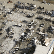 East view of tornado damage of Amazon warehouse